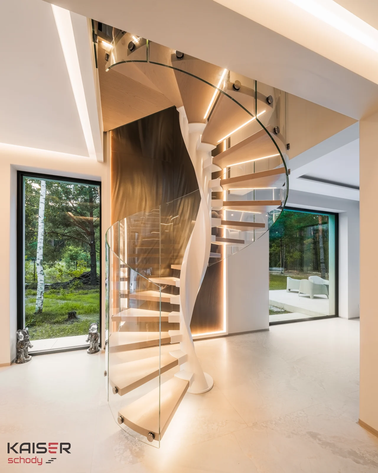 Full-height view of a light-coloured spiral staircase