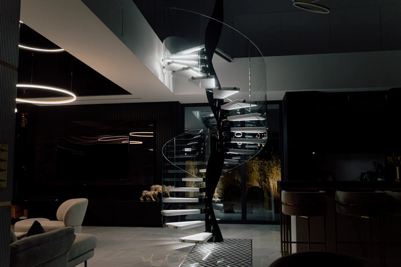 Spiral staircase with illuminated treads in the evening